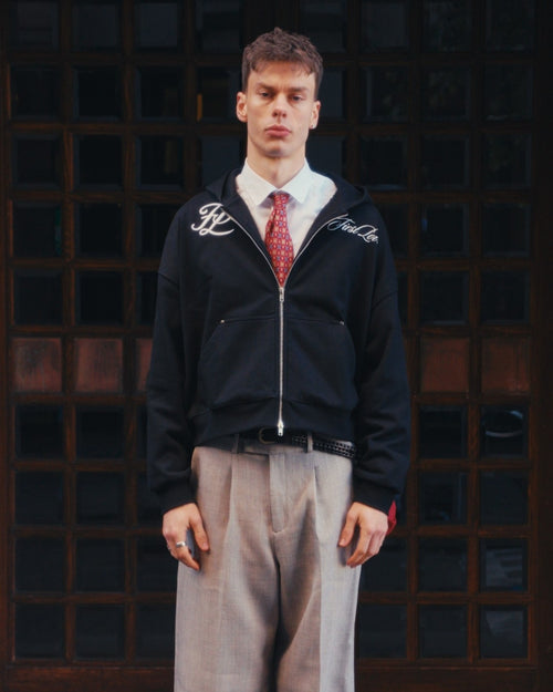 Black hoodie on body, front, styled with shirt and tie
